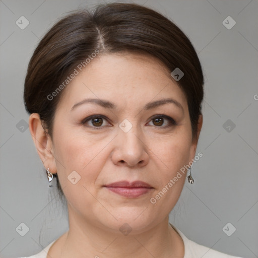 Joyful white adult female with medium  brown hair and brown eyes