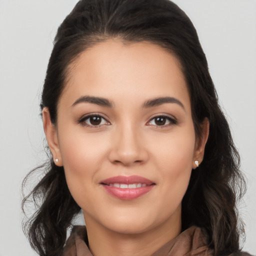 Joyful white young-adult female with long  black hair and brown eyes