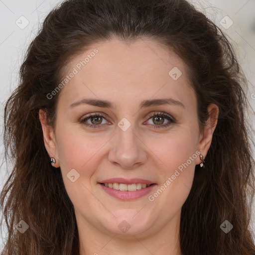 Joyful white adult female with long  brown hair and brown eyes