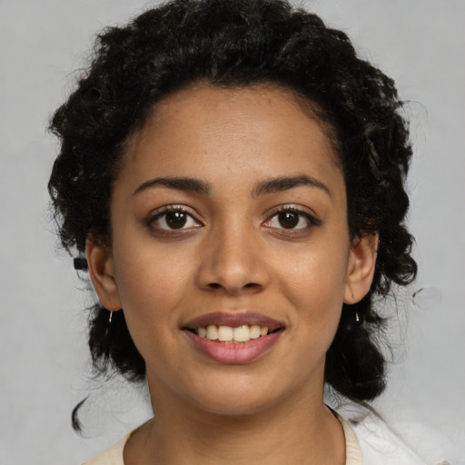 Joyful latino young-adult female with medium  black hair and brown eyes