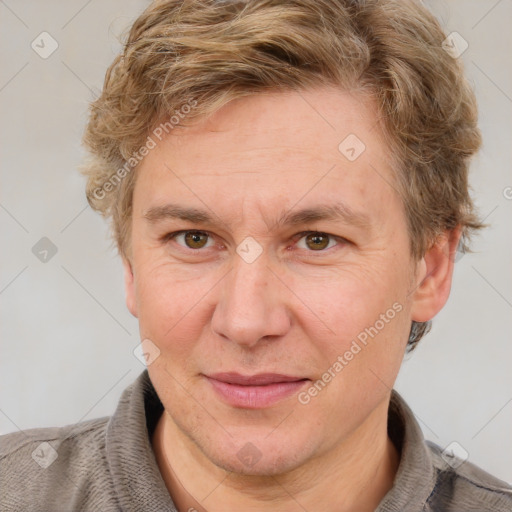 Joyful white adult male with short  brown hair and grey eyes