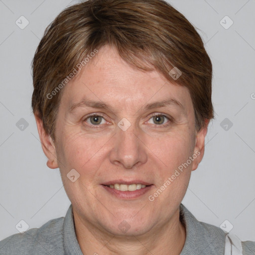 Joyful white adult female with short  brown hair and grey eyes