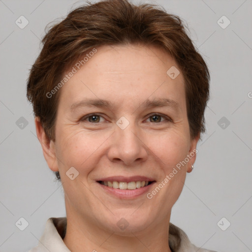 Joyful white adult female with short  brown hair and brown eyes