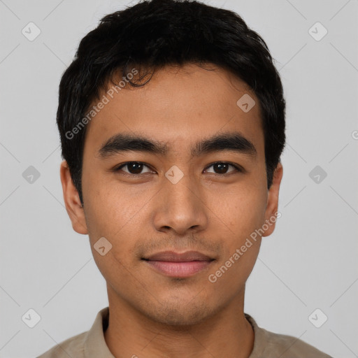 Joyful latino young-adult male with short  black hair and brown eyes