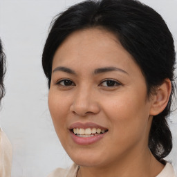 Joyful white young-adult female with medium  brown hair and brown eyes