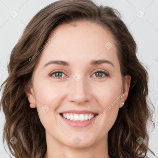 Joyful white young-adult female with long  brown hair and green eyes