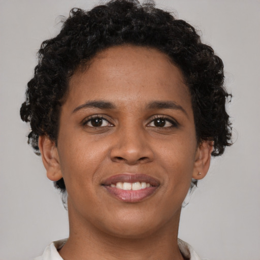 Joyful latino young-adult female with short  brown hair and brown eyes