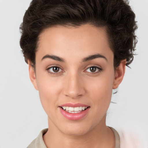 Joyful white young-adult female with short  brown hair and brown eyes