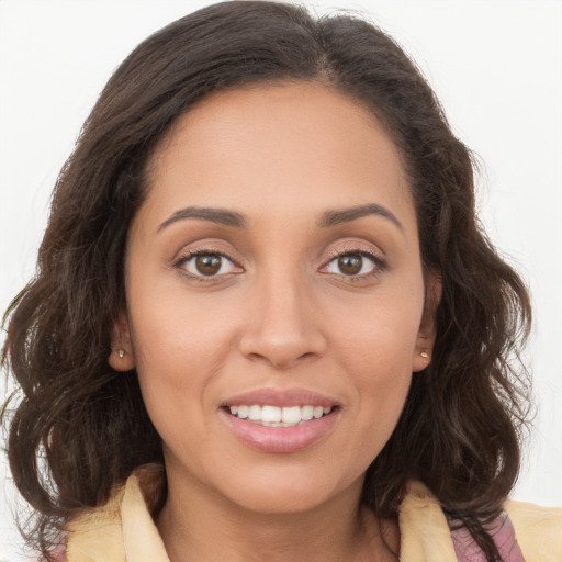 Joyful white young-adult female with long  brown hair and brown eyes