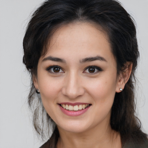 Joyful asian young-adult female with medium  brown hair and brown eyes