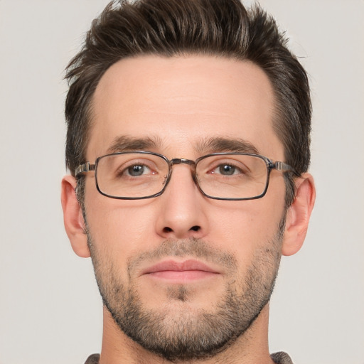 Joyful white young-adult male with short  brown hair and brown eyes