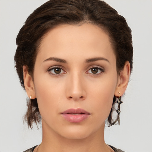 Neutral white young-adult female with short  brown hair and brown eyes