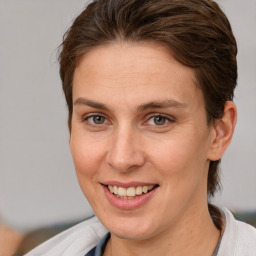 Joyful white adult female with short  brown hair and brown eyes