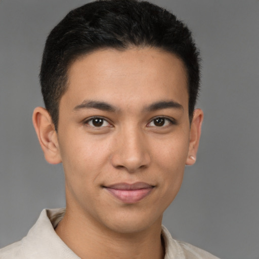 Joyful latino young-adult male with short  brown hair and brown eyes