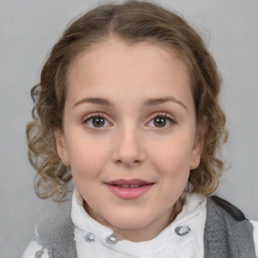 Joyful white child female with medium  brown hair and blue eyes