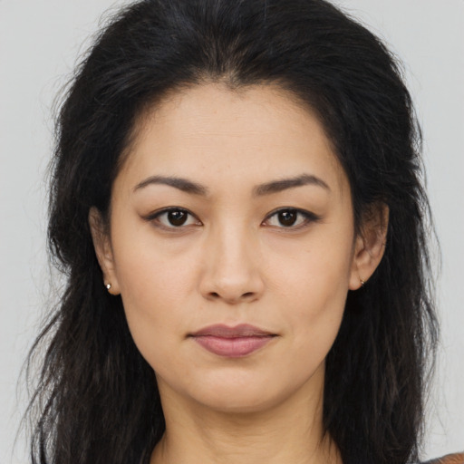 Joyful asian young-adult female with long  brown hair and brown eyes