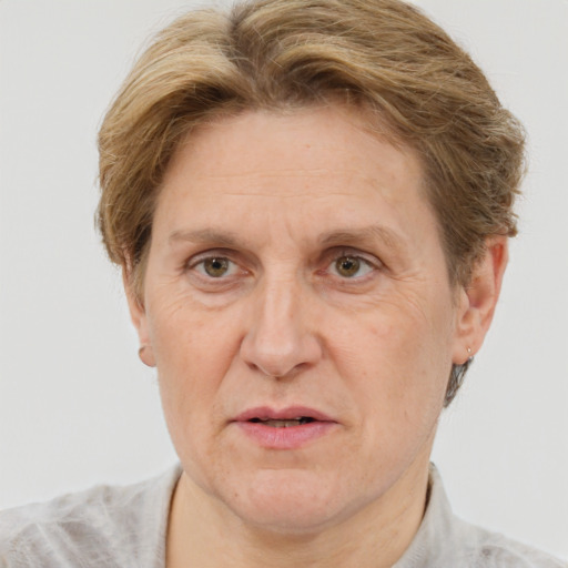 Joyful white middle-aged female with short  brown hair and grey eyes