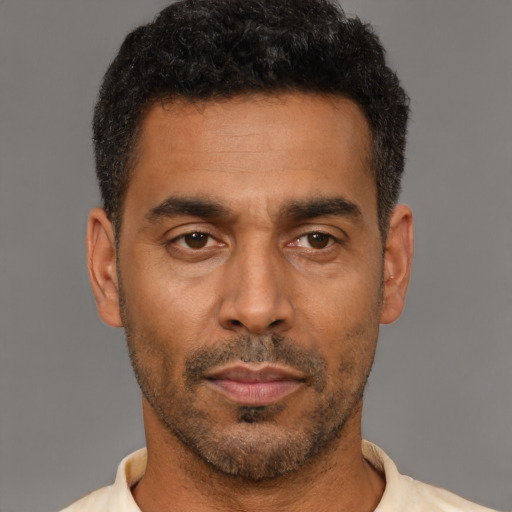 Neutral latino adult male with short  black hair and brown eyes