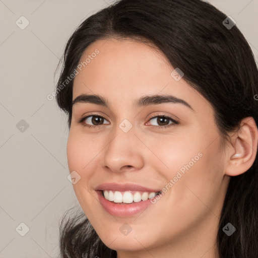 Joyful white young-adult female with long  brown hair and brown eyes