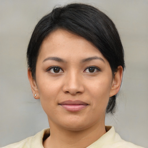 Joyful asian young-adult female with medium  black hair and brown eyes