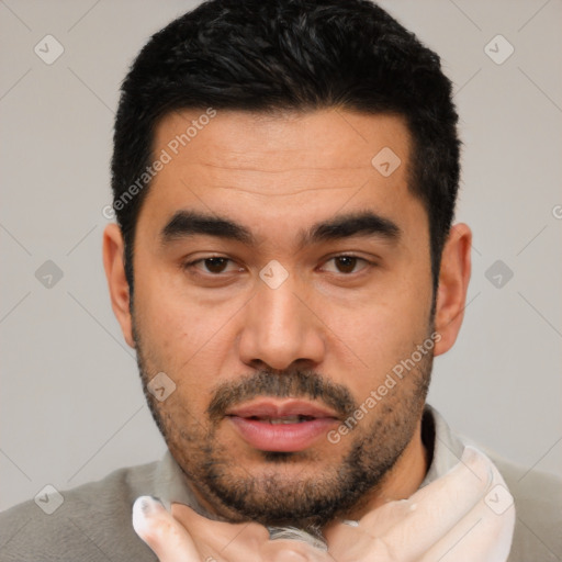 Joyful latino young-adult male with short  black hair and brown eyes