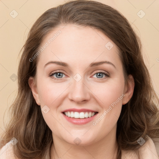 Joyful white young-adult female with long  brown hair and green eyes