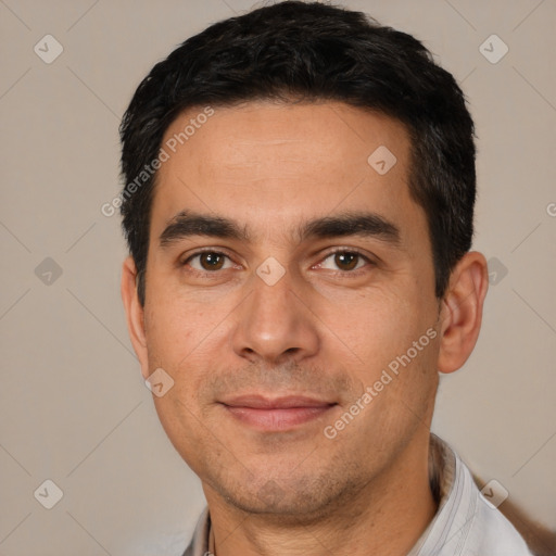 Joyful white adult male with short  black hair and brown eyes