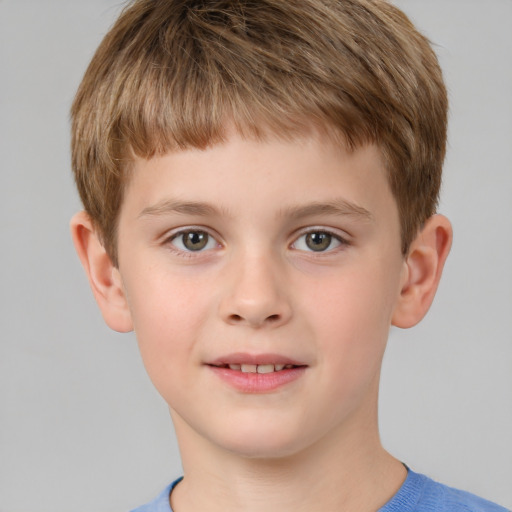 Joyful white child male with short  brown hair and brown eyes