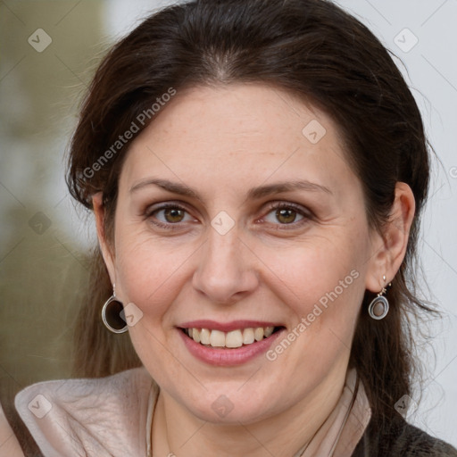 Joyful white adult female with medium  brown hair and grey eyes