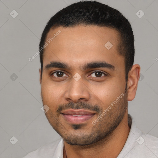 Joyful black young-adult male with short  black hair and brown eyes