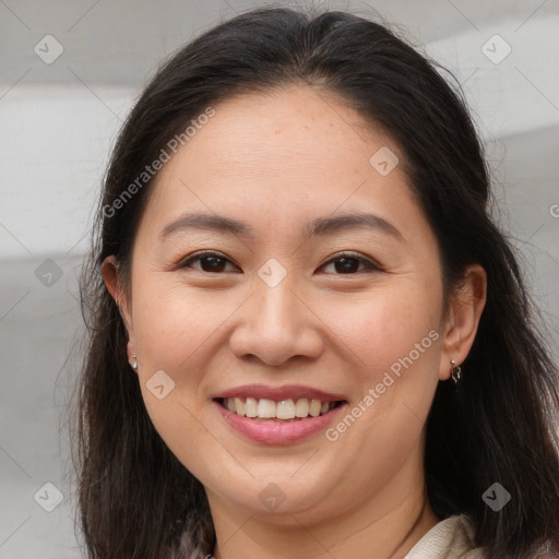 Joyful white young-adult female with long  brown hair and brown eyes