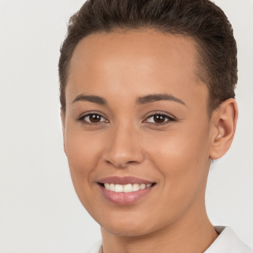 Joyful white young-adult female with short  brown hair and brown eyes