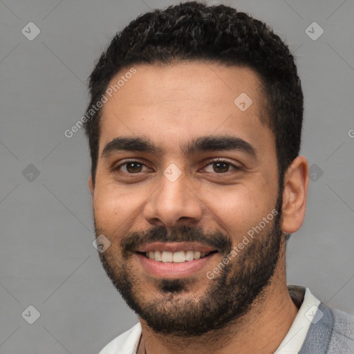 Joyful white young-adult male with short  black hair and brown eyes