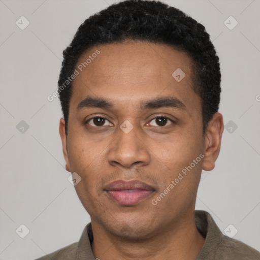 Joyful black young-adult male with short  black hair and brown eyes