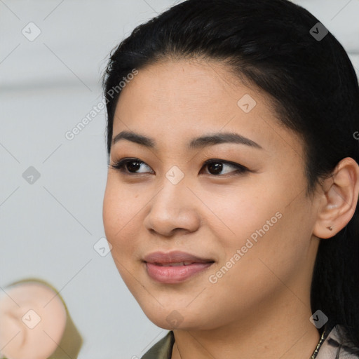 Joyful asian young-adult female with medium  black hair and brown eyes