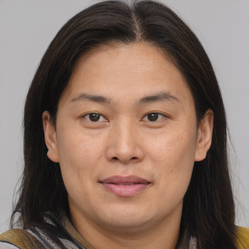 Joyful asian adult female with medium  brown hair and brown eyes