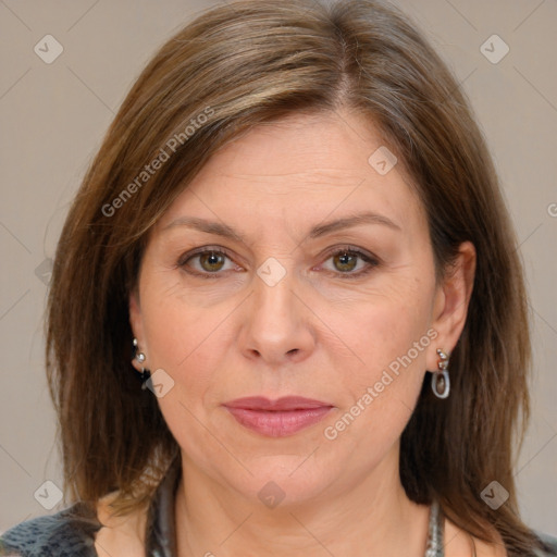 Joyful white adult female with medium  brown hair and grey eyes