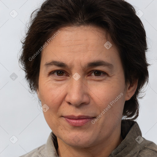 Joyful white adult female with short  brown hair and brown eyes