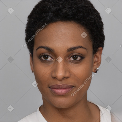 Joyful black young-adult female with short  black hair and brown eyes