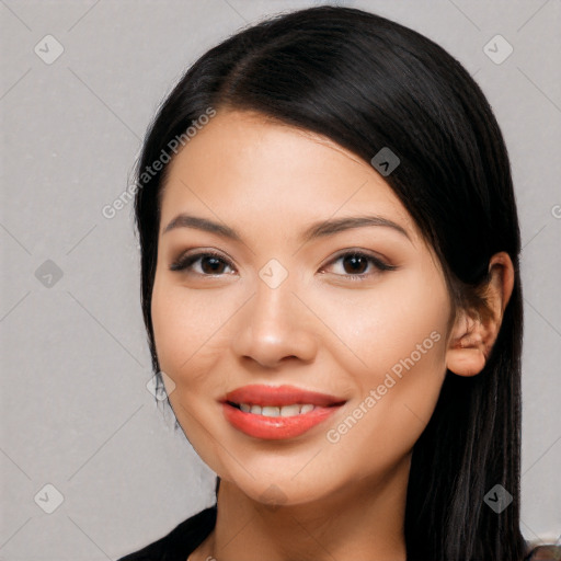 Joyful white young-adult female with long  black hair and brown eyes