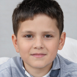 Joyful white child male with short  brown hair and brown eyes