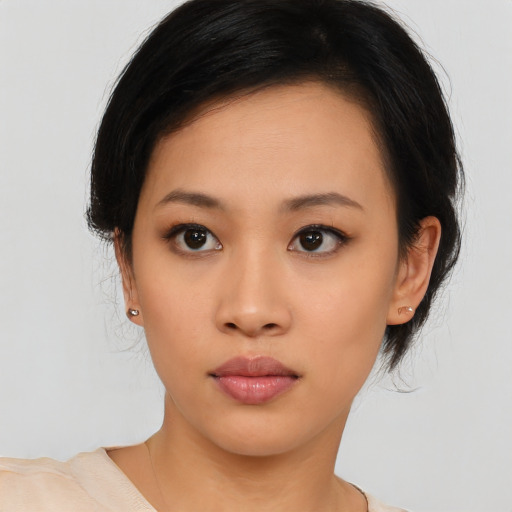 Neutral asian young-adult female with medium  black hair and brown eyes