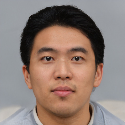 Neutral asian young-adult male with short  black hair and brown eyes