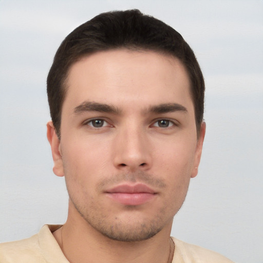 Neutral white young-adult male with short  brown hair and brown eyes