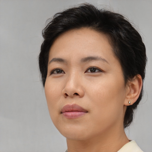 Neutral asian young-adult female with medium  brown hair and brown eyes