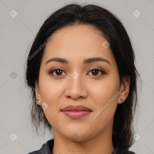 Joyful latino young-adult female with medium  brown hair and brown eyes