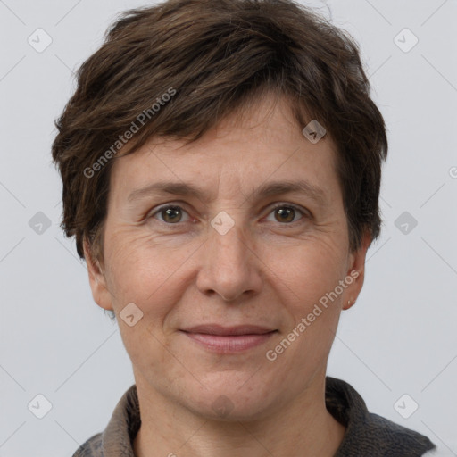 Joyful white adult female with short  brown hair and brown eyes