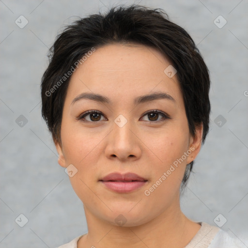 Joyful asian young-adult female with short  brown hair and brown eyes