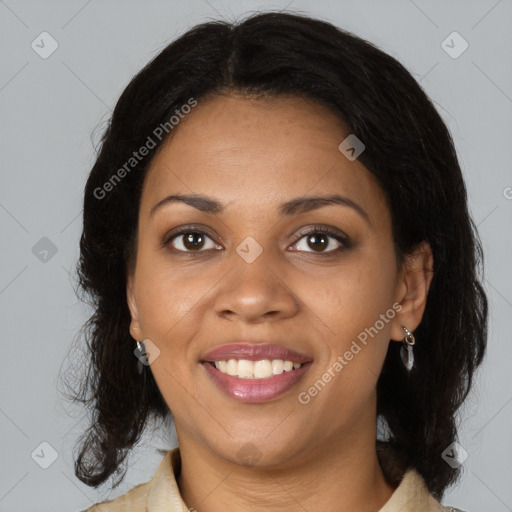 Joyful black young-adult female with medium  brown hair and brown eyes