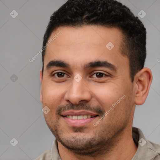 Joyful white young-adult male with short  brown hair and brown eyes